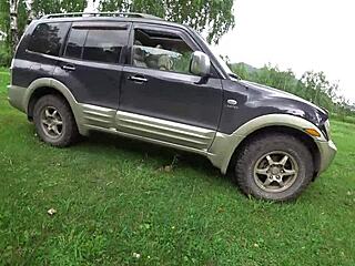 A lesbian brutally fucks a mature milf in the car, focusing on her big tits and fat ass in sexy underwear from POV.