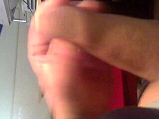 Guy discreetly strokes his cock in a crowded internet cafe