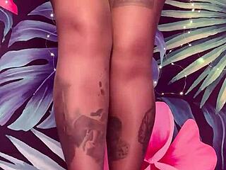 She teases in pantyhose and latex dress.