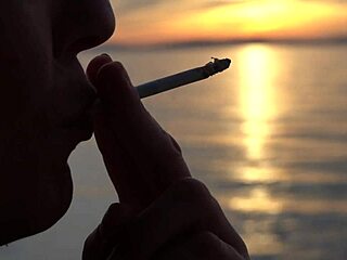 Blonde European Milf Smoking Cigarettes On The Beach At Day And Sunset