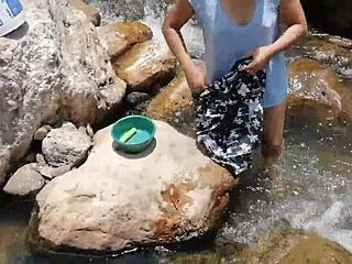 Crossdressing and washing clothes in the river