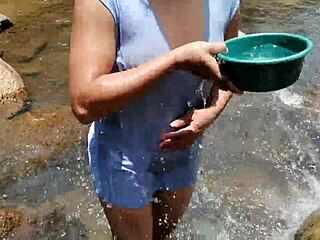 Crossdressing Person Washing in a River Scene