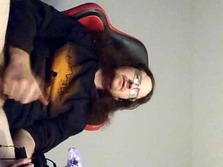 GUY WITH LONG HAIR JERKS OFF WHILE PLAYING GAMES IN THIS SOLO BI SESSION PT1