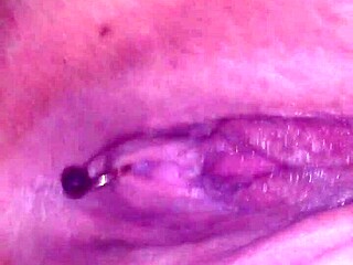 Sensual watered-down pleasure with a pierced vagina