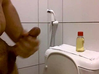 Amateur Gives Oiled Handjob Leading To Cumshot