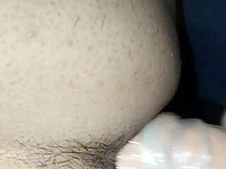 A wife using a large dildo to pleasure her partner