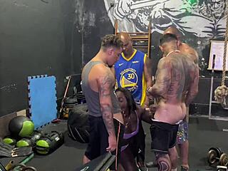 A diverse group of men sexually engaged with a voluptuous African American woman in a fitness center