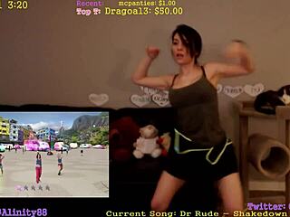 alinity is doing a sexy dance, shaking her ass and tits