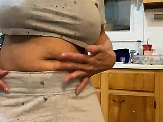anna maria teases while doing dishes and dancing