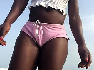 Crazy bitch, twerk hard on the beach in sexy clothes?