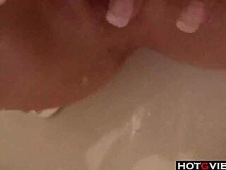 Hot Brunette in Bathtub Using Toys for Self-Pleasure