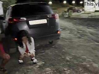two girlfriends pee together in public parking lot