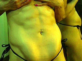 Busty Ginger Flexes Big Muscles in Mirror