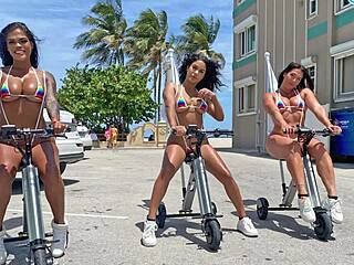 Big ass Latinas ride electric trikes at public beach