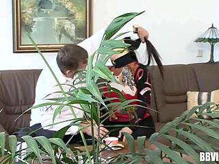 An Asian woman gives a blowjob to a German man in this video