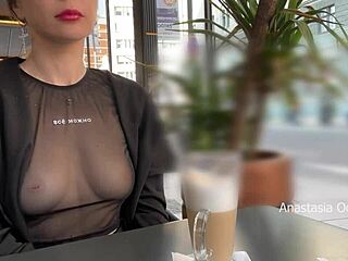 See-through tee in a glass cafe: ultimate public display