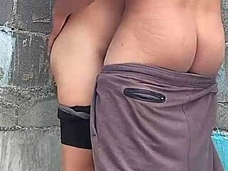 Feeling the passion against the wall with my brunette neighbor, her brown eyes full of desire.