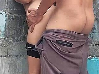 Feeling the passion against the wall with my brunette neighbor, her brown eyes full of desire.