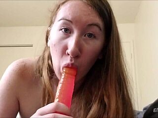 Redhead with tattoos sucks dick using toys and dildo