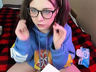 Nerdy glasses girl masturbates and swallows a dildo on webcam