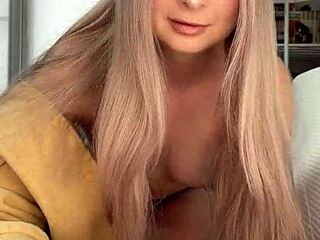 In this intimate scene, pretty Amelie Dubon gives a close-up handjob to her friend, leading to a cumshot.