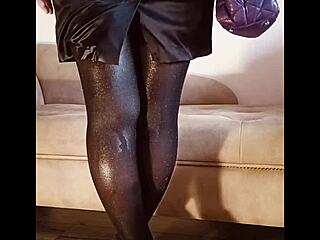 Free solo video of a woman wearing shiny pantyhose while she urinates