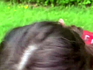 Beautiful woman gives blow job to big black cock in the park