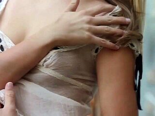 Kenna James waters the plants in the garden