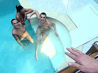 Three beautiful women share one man sexually in the swimming pool