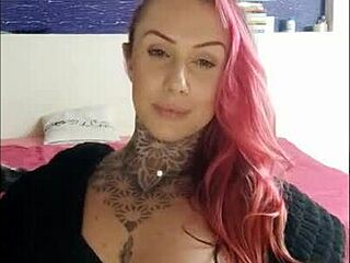 Sensual girl smoking, teasing with big tits on webcam.