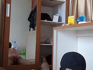 A hot gay in a red CD mask and dress has anal sex