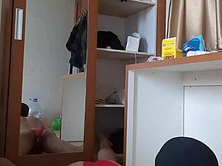 Sexy gay in red underwear and mask plays with dildo