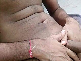 In the public outdoors, two young indian desi gays have fun with a horny big cock.