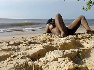 A young woman dances naked in the forest near a beach and gets some street attention