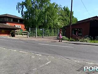 A red-haired black beauty gets naked and urinates outdoors