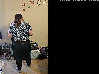 A striptease dance routine by a brunette MILF