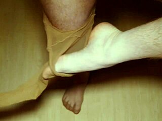 Redhead's solo pleasure with pantyhose and foot fetish