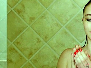 Charming brunette model enjoys relaxing shower