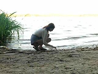 teen redhead mia reaches wild orgasm beside lake with shaved pussy exposed