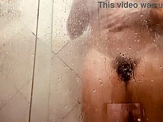 Muscular MILF washing her hairy pussy in the bath