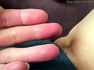 A girl enjoys a relaxing shower with her favorite toy, caressing gently.