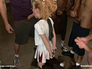 Uniformed cheerleaders get it from all sides in a hot BDSM scene