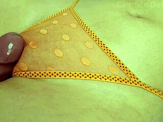 A petite girl masturbates and moans while rubbing her panty pussy with creamy cum