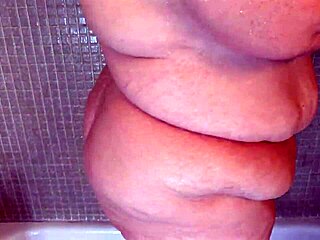 Steamy shower time with a big-boobed, fat MILF