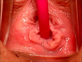 Close up of a pink vagina while it is being stimulated and climaxing