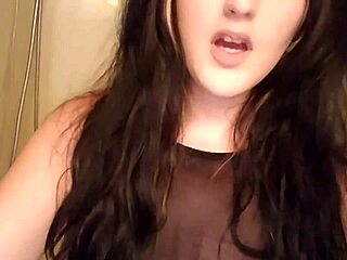 Goth girl indulges in a unique beverage.