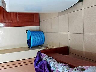 malaya is taking off her clothes in the room alone