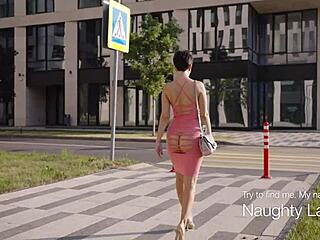 Public display of free-spirited woman in a short dress and free boobs