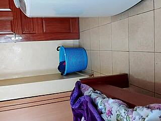 malaya is taking off her clothes in the room alone