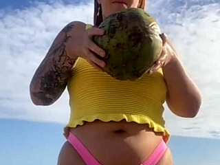 Young exhibitionist flashes in a revealing bikini on the beach